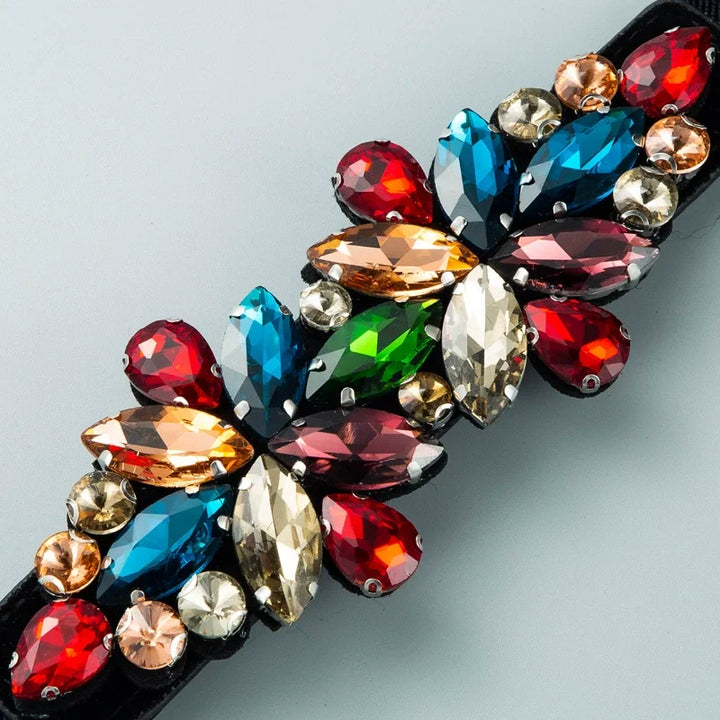 Rhinestone corset waist belt close-up with multicolor marquise stones on black strap