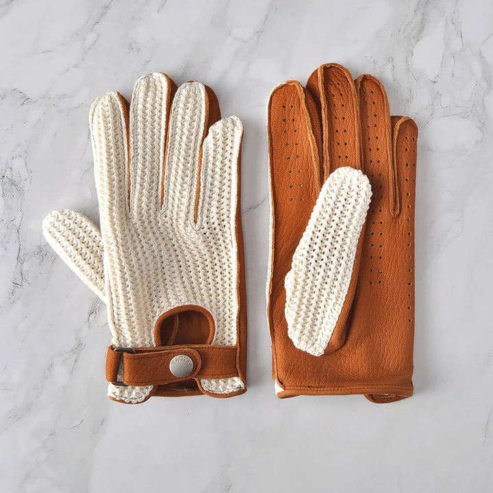 Pair of white knitted gloves with brown leather backs and perforation detail.