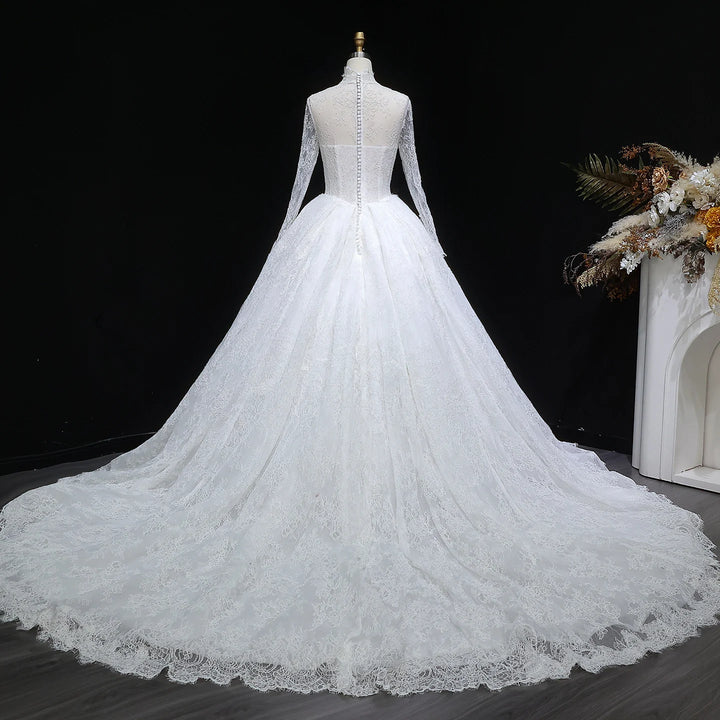 White lace high-neck wedding gown with long sleeves and full A-line skirt
