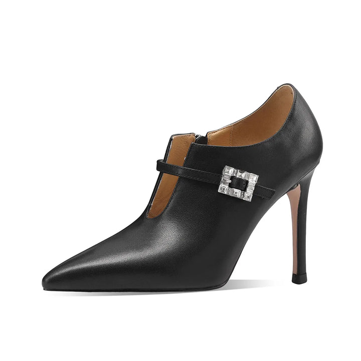 Black pointed-toe pumps with stiletto heel and silver buckle strap detail
