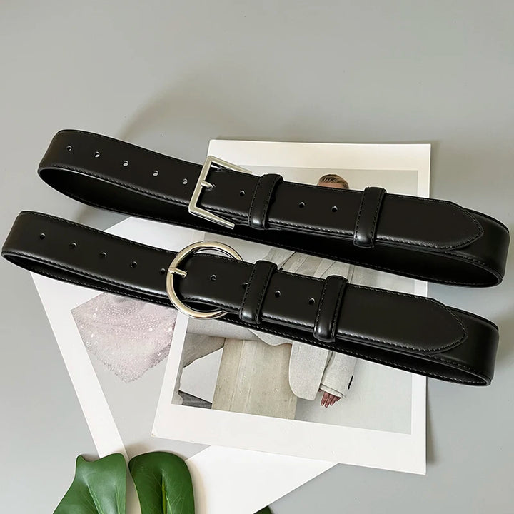 Black wide leather corset belt with silver-tone rectangular buckle and punched holes