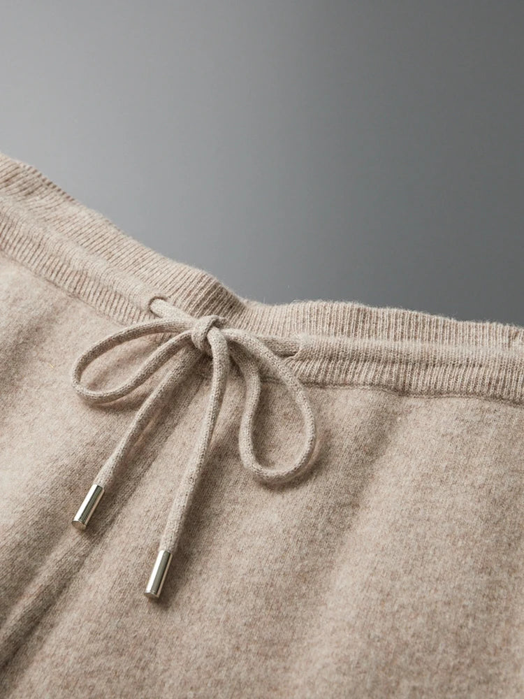 Beige wool knit sweatpants waistband with drawstring and metal tips