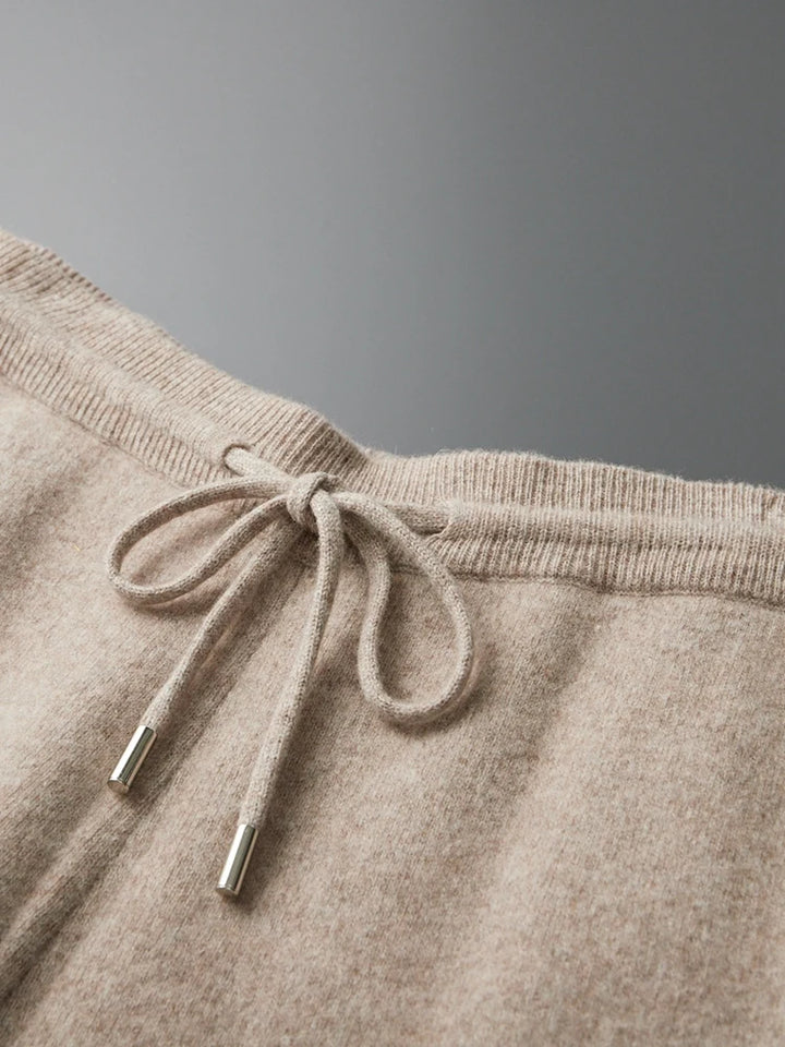Beige wool knit sweatpants waistband with drawstring and metal tips