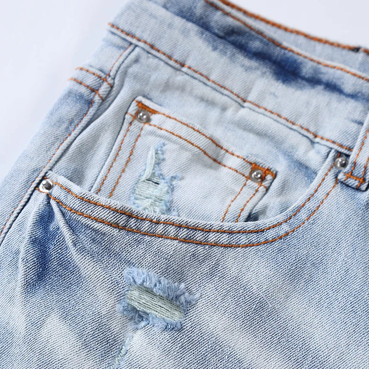 Trendy Perforated Patch Slim Jeans Pants