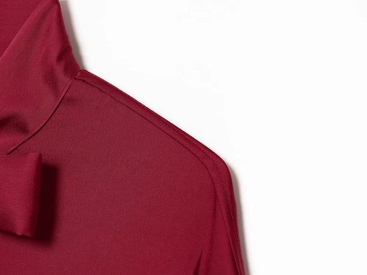 Red satin blouse shoulder and curved neckline with bow tie detail