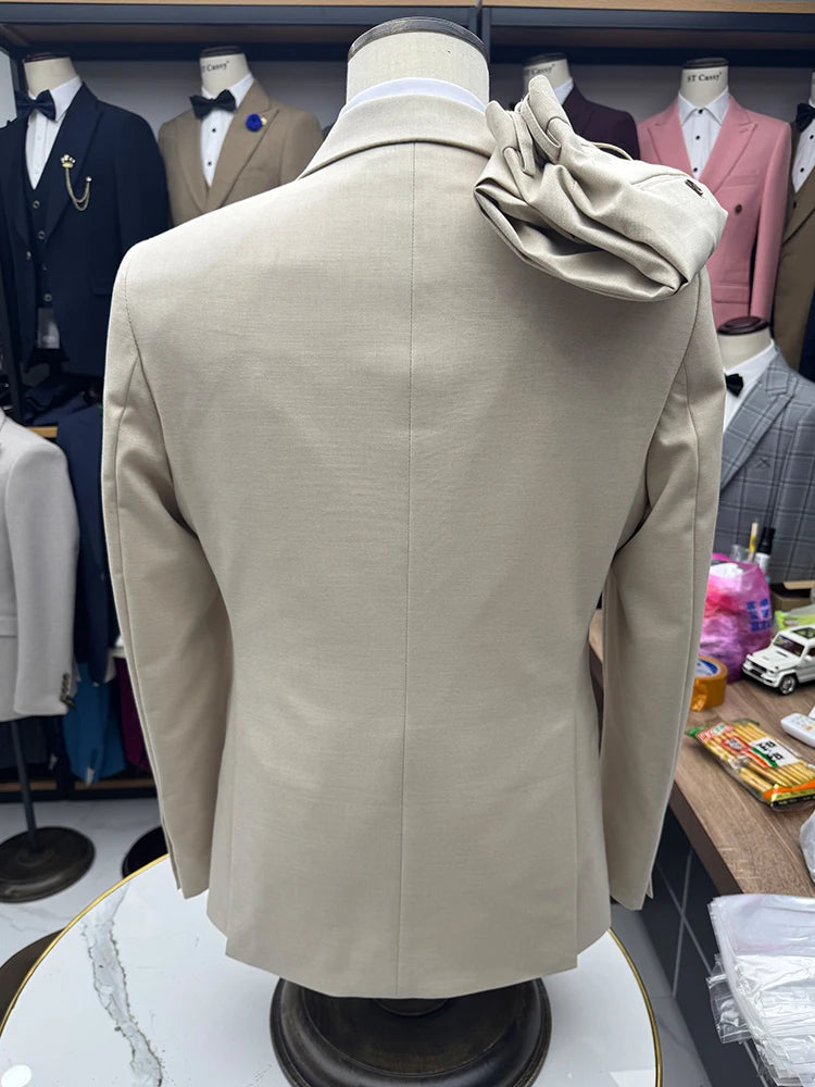 Beige suit jacket on mannequin, back view, with draped shirt and burgundy bow tie