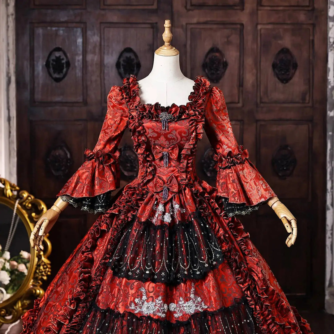 Wine-red ball gown with corset bodice, ruched pattern, off-shoulder ruffle trim