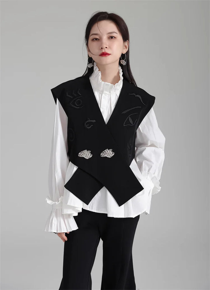 Black irregular women’s suit waistcoat, V-neck with embroidered accents and silver button pair.