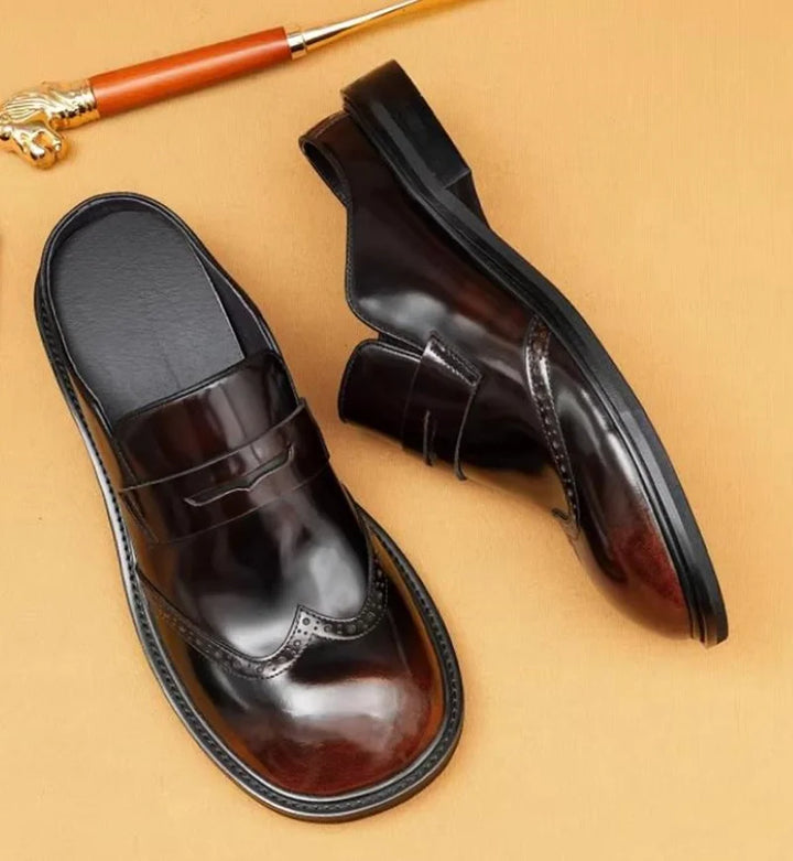 Wine red leather men’s slip-on mules with glossy finish and wingtip-style front