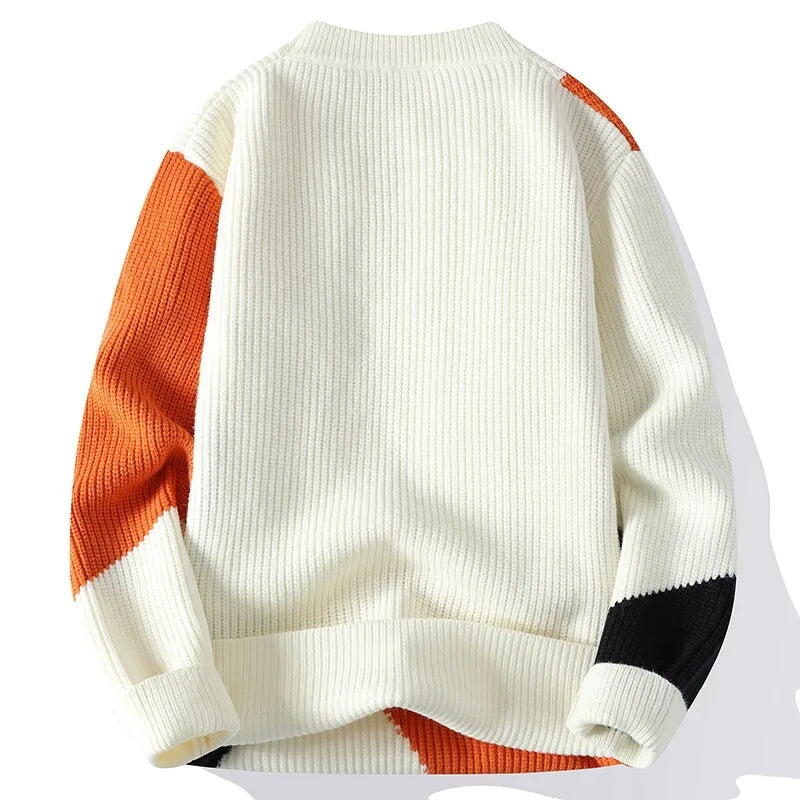 Thick warm pullover sweater in white knit with orange and black colorblock panels