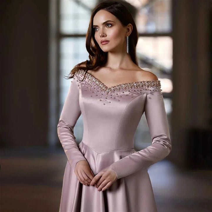 Mauve satin off-shoulder A-line skirt with rhinestone neckline and long sleeves