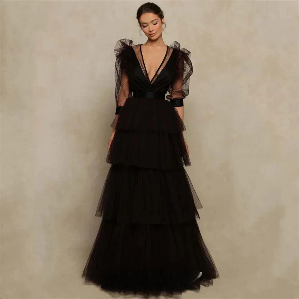 Black formal evening ball gown with deep V-neck and sheer puff sleeves