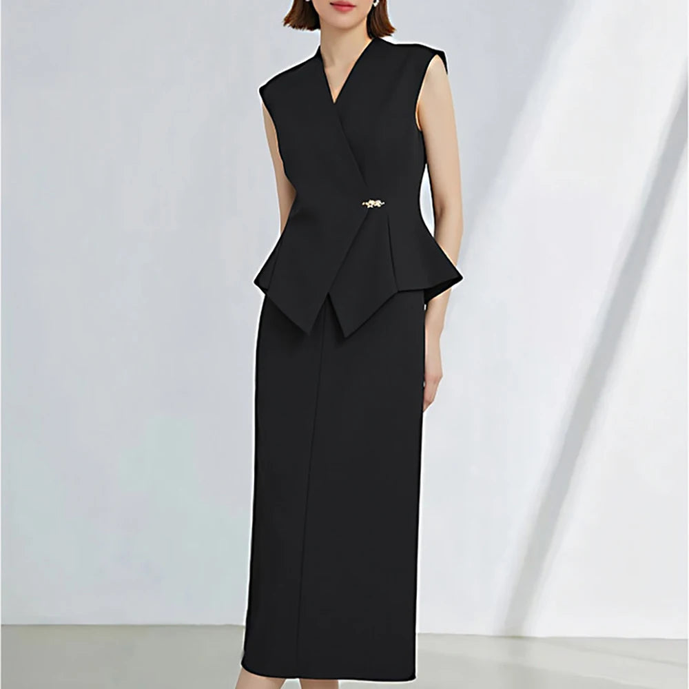 Black womens peplum vest and mid-calf skirt set with draped hem detail