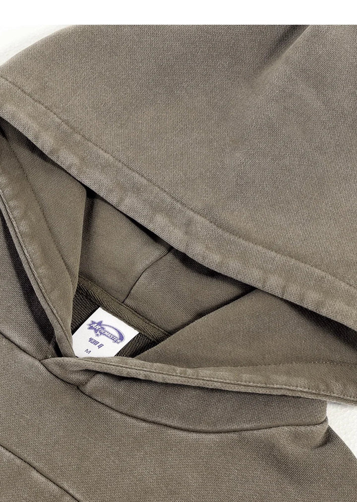 Close-up of a brown fabric with a visible brand label on a white background