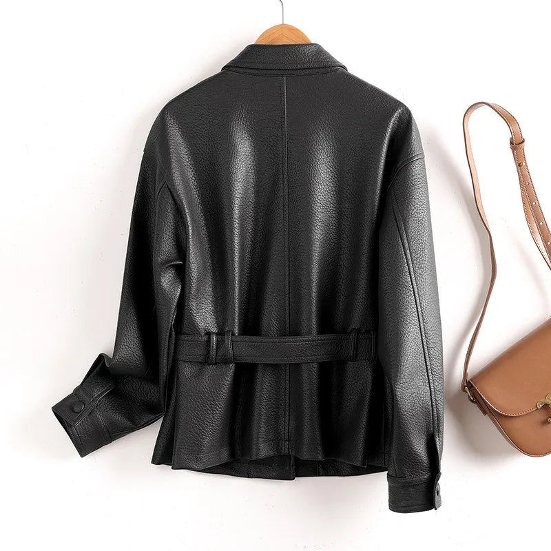 Black leather women’s coat with stand collar, belt waist, flap pockets, button cuffs