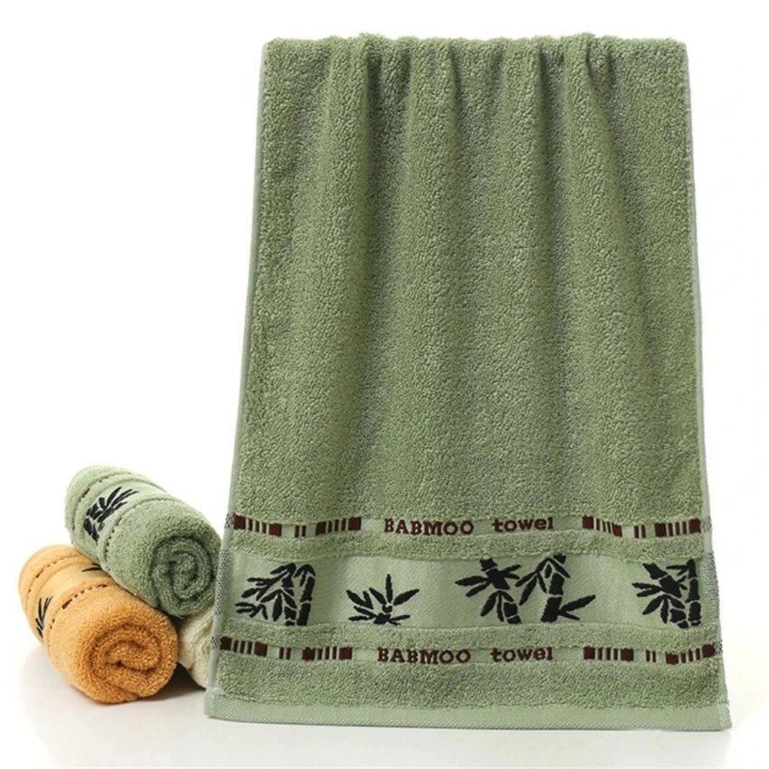 Bamboo bath towel set: green towel with printed band and rolled towels