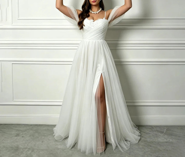 White A-line tulle bridal gown with sweetheart bodice, gathered waist, long front slit