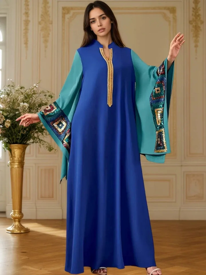 Blue abaya dress with flowing batwing sleeves, turquoise cuffs with geometric embroidery