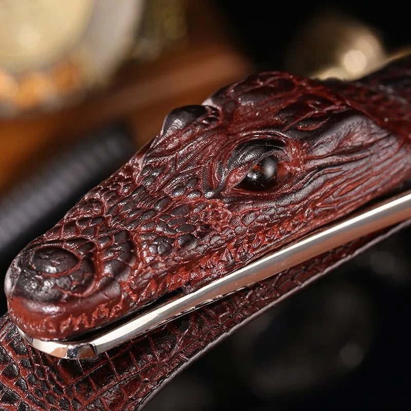 Close-up of a leather belt with a crocodile head design.