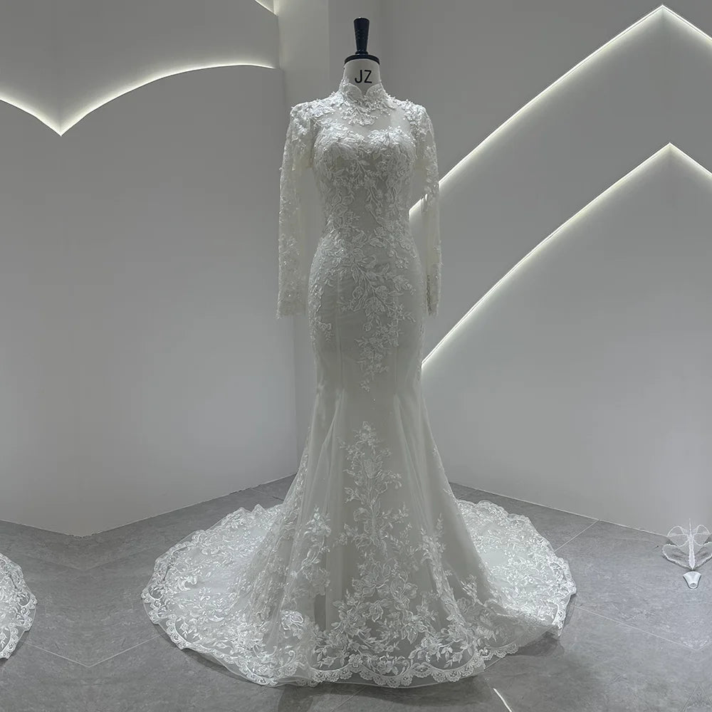 Ivory lace high-neck wedding gown with long sleeves and voluminous lace train