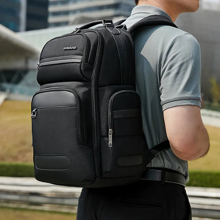 Black men’s backpack worn with front zip pocket and side bottle sleeve