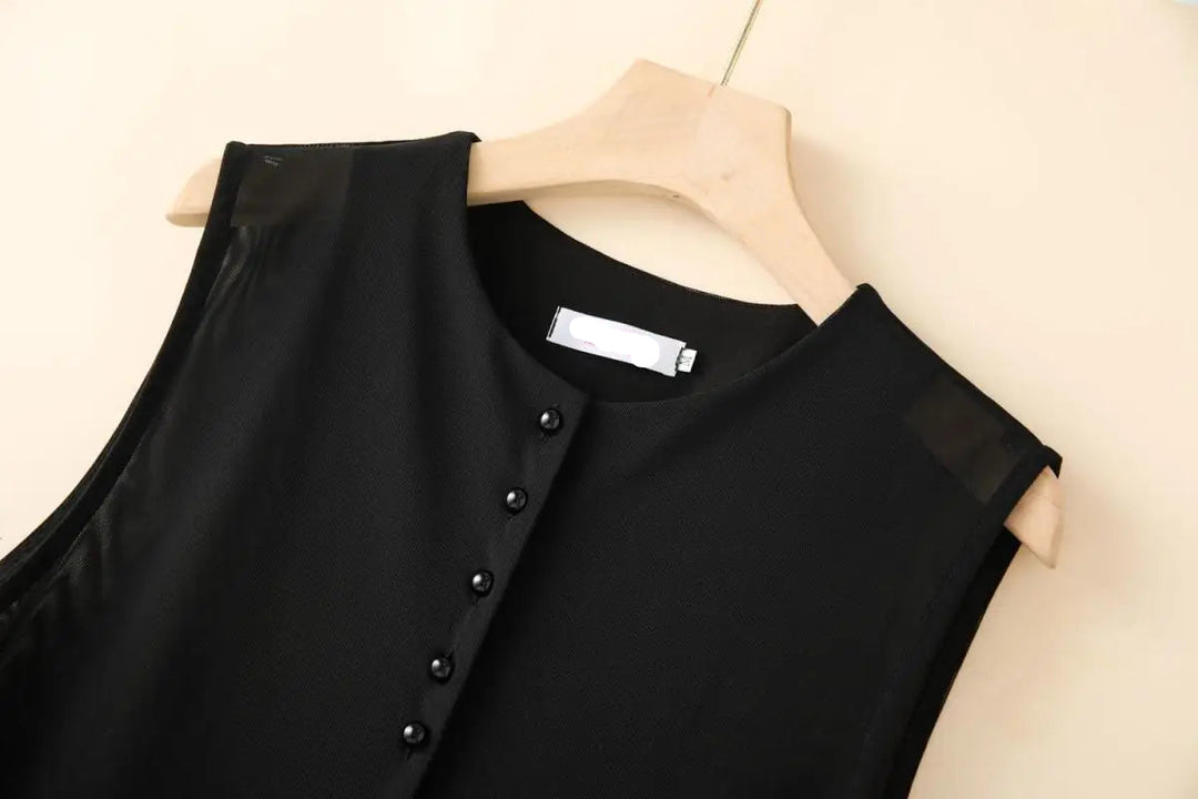 Black sleeveless mesh vest with snap-button front and irregular layered hem