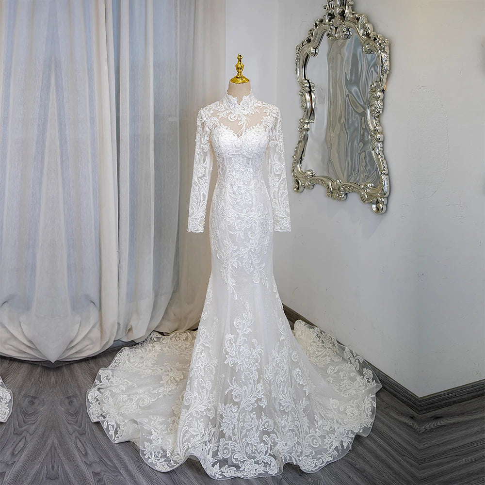 Ivory lace high-neck long-sleeve bridal gown with mermaid silhouette and flowing train