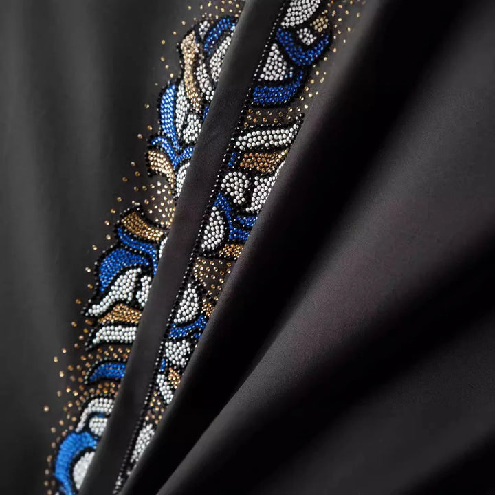 Rhinestone front placket detail with blue, gold, and white bead pattern
