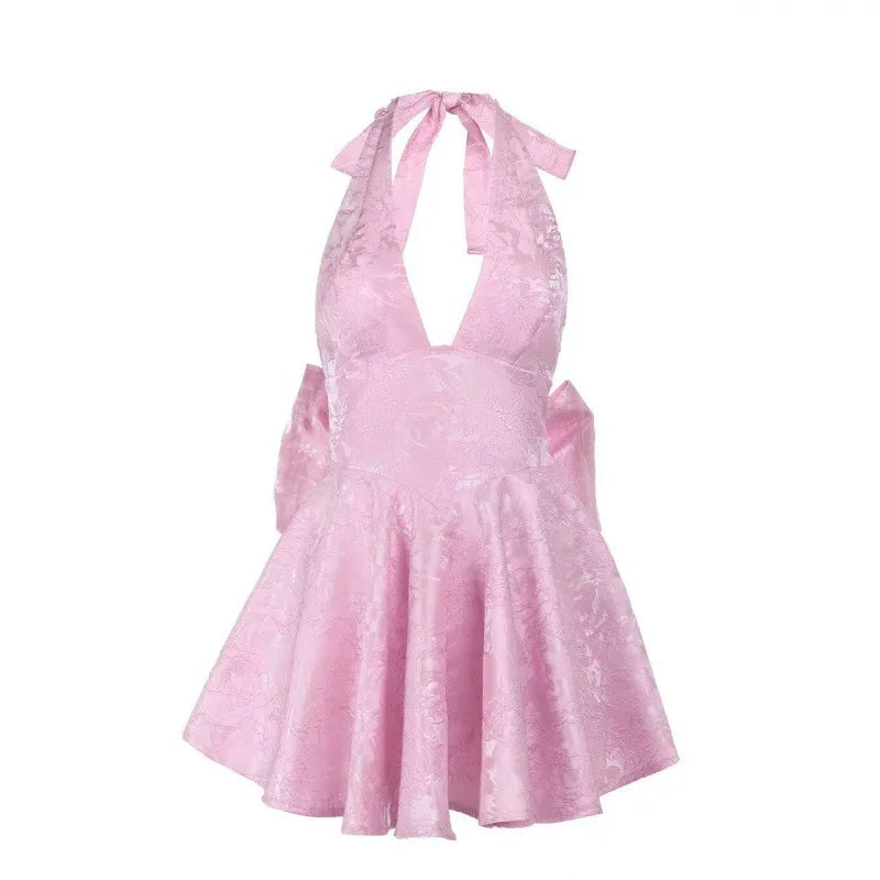 Pink mini A-line halter dress cutout with tie bow and flared skirt