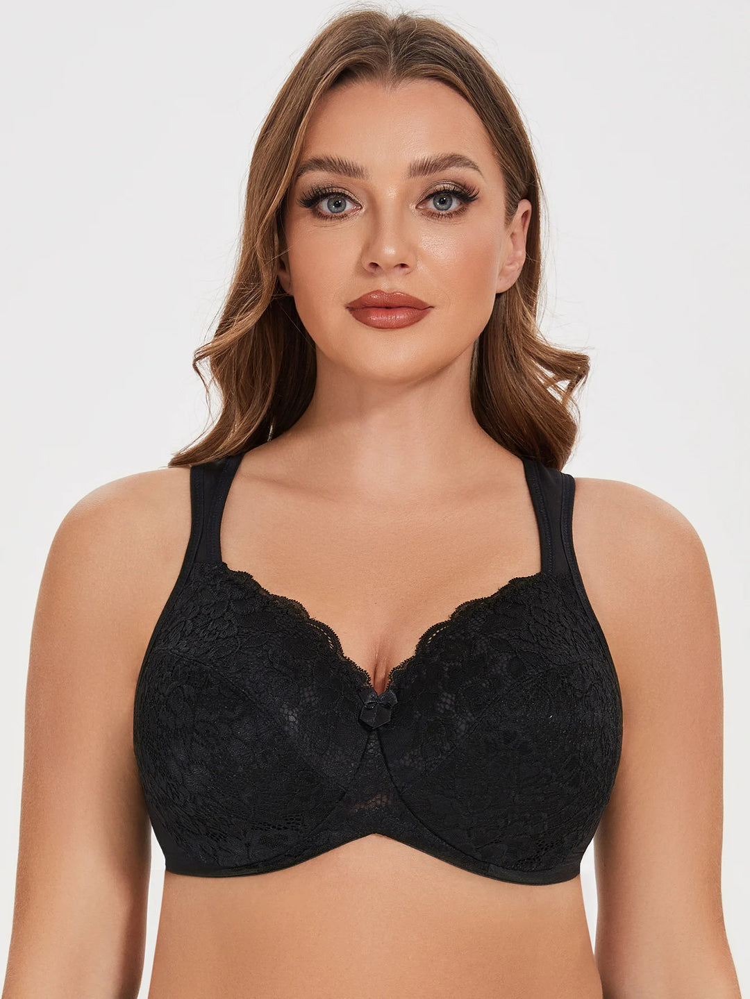 Black lace underwire bra with scalloped cups and center bow detail