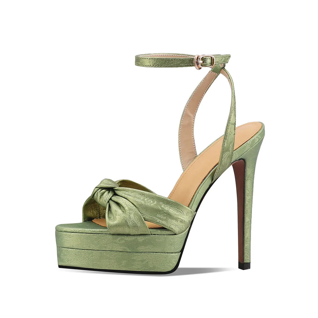 Green women's leather platform heeled sandals with ankle strap and bow at toe