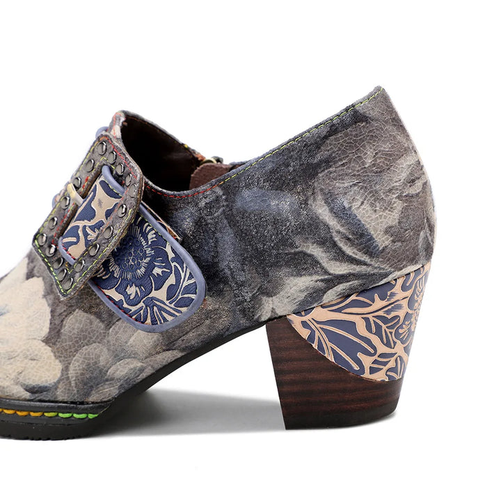 Women’s genuine leather dress pumps angled view, gray floral upper with patterned blue heel panel