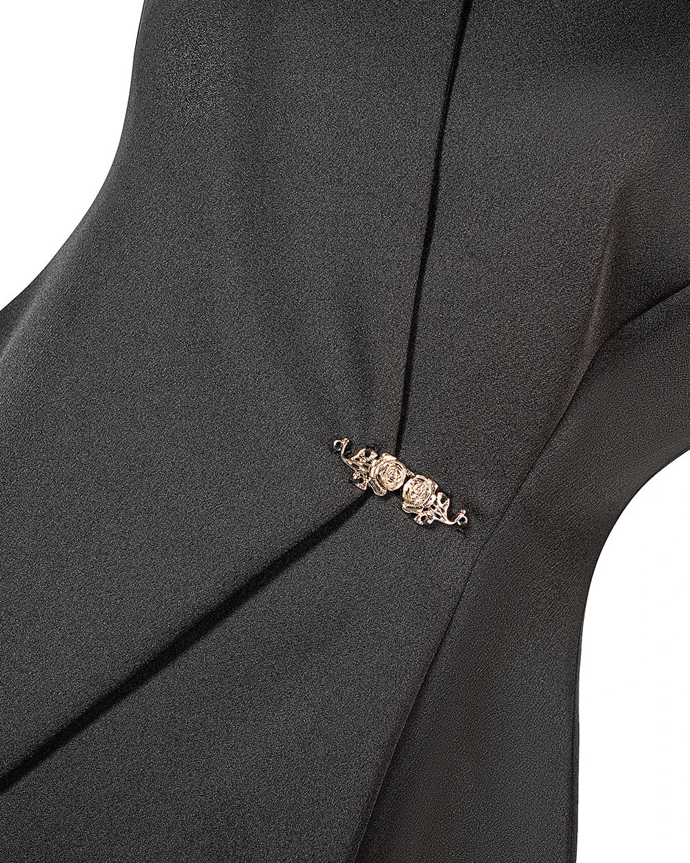 Close-up of gold-toned clasp detail on black peplum vest front overlay