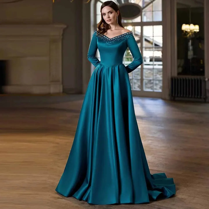 Teal off-shoulder A-line dress with rhinestone bodice and long sleeves