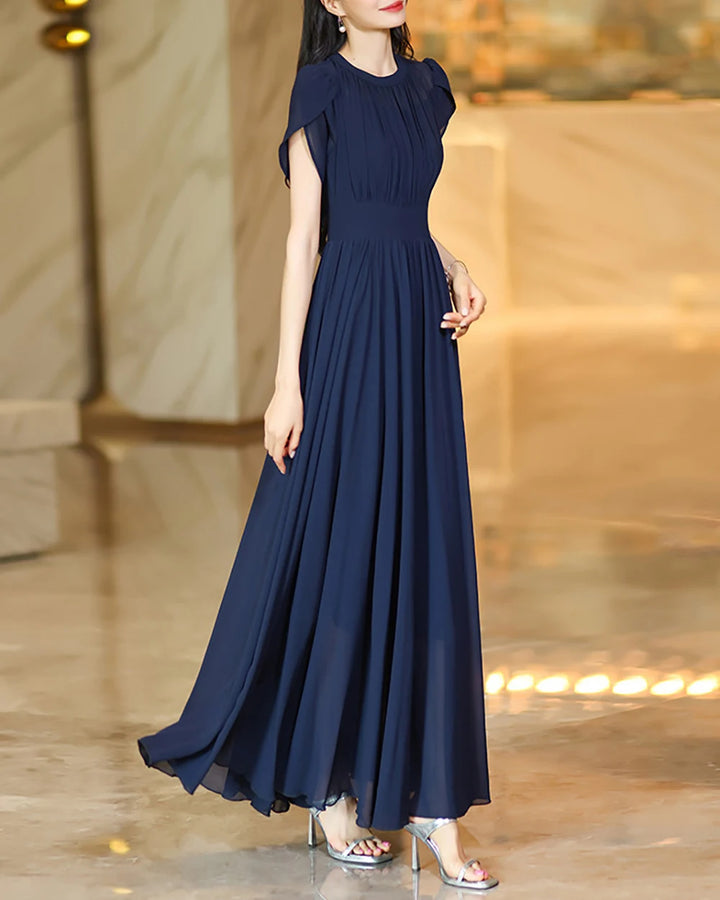 Navy A-line maxi skirt with soft pleats and gathered waist at the front