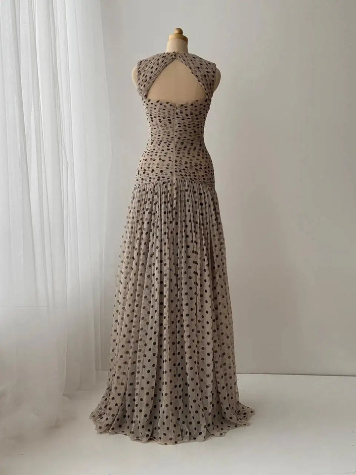 Polka dot chiffon evening dress on mannequin, scoop neckline, gathered skirt, off-white