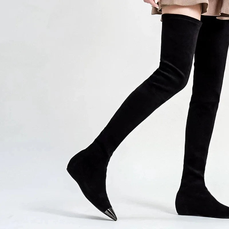 Black thigh-high faux suede boots, pointed toe and narrow heel.