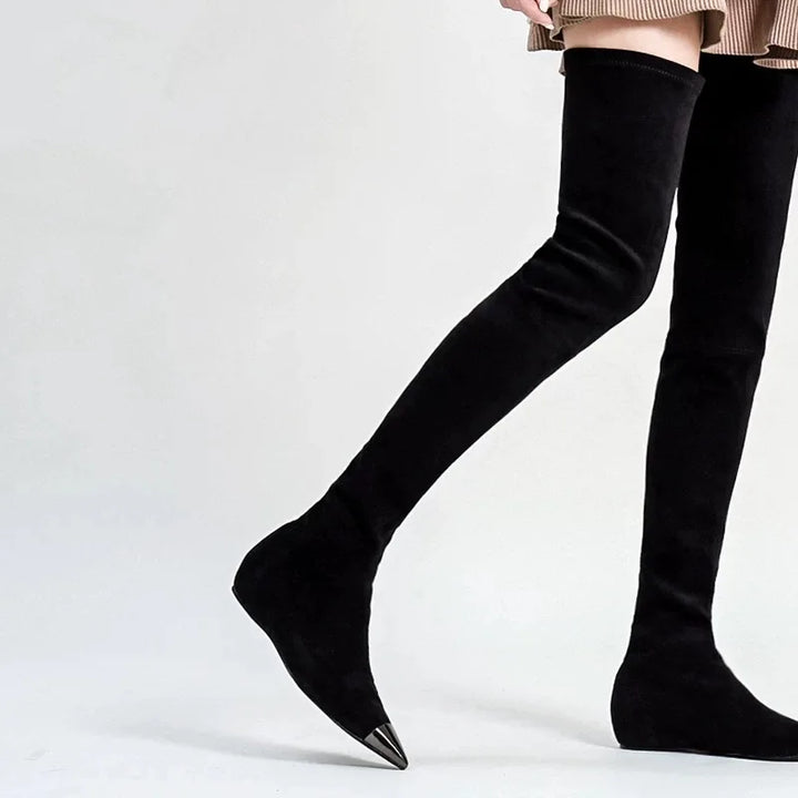 Black thigh-high faux suede boots, pointed toe and narrow heel.