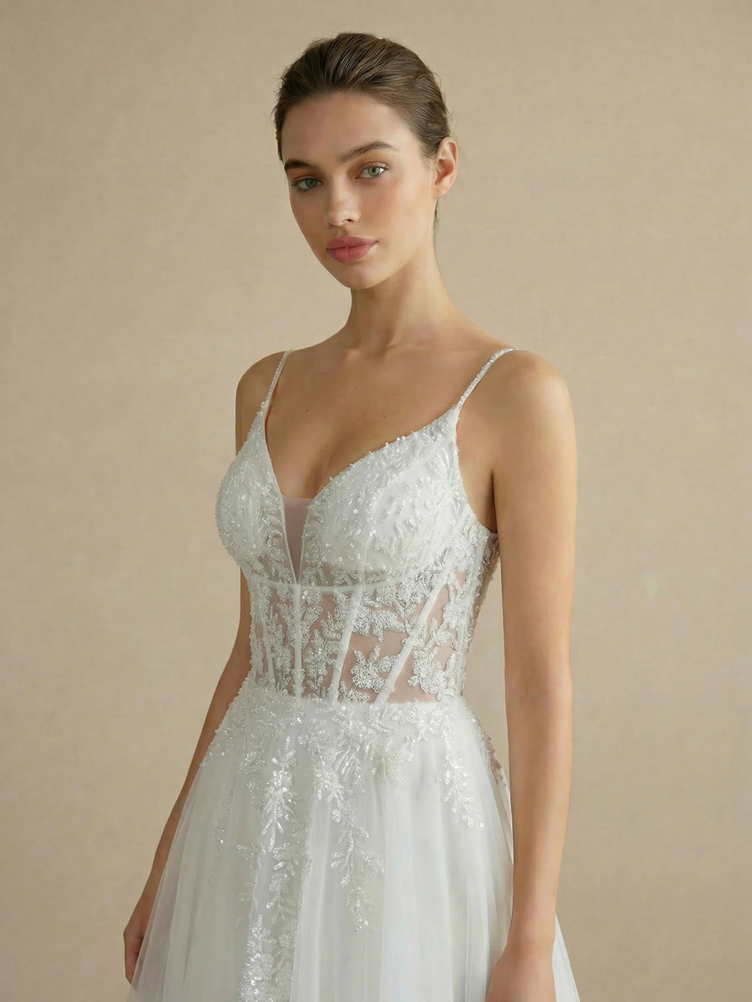 White lace tulle bridal ball gown with V-neck bodice and floral lace applique detail