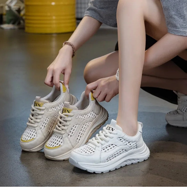 Light beige woven mesh lace-up sneakers with yellow collar accents and chunky sole.