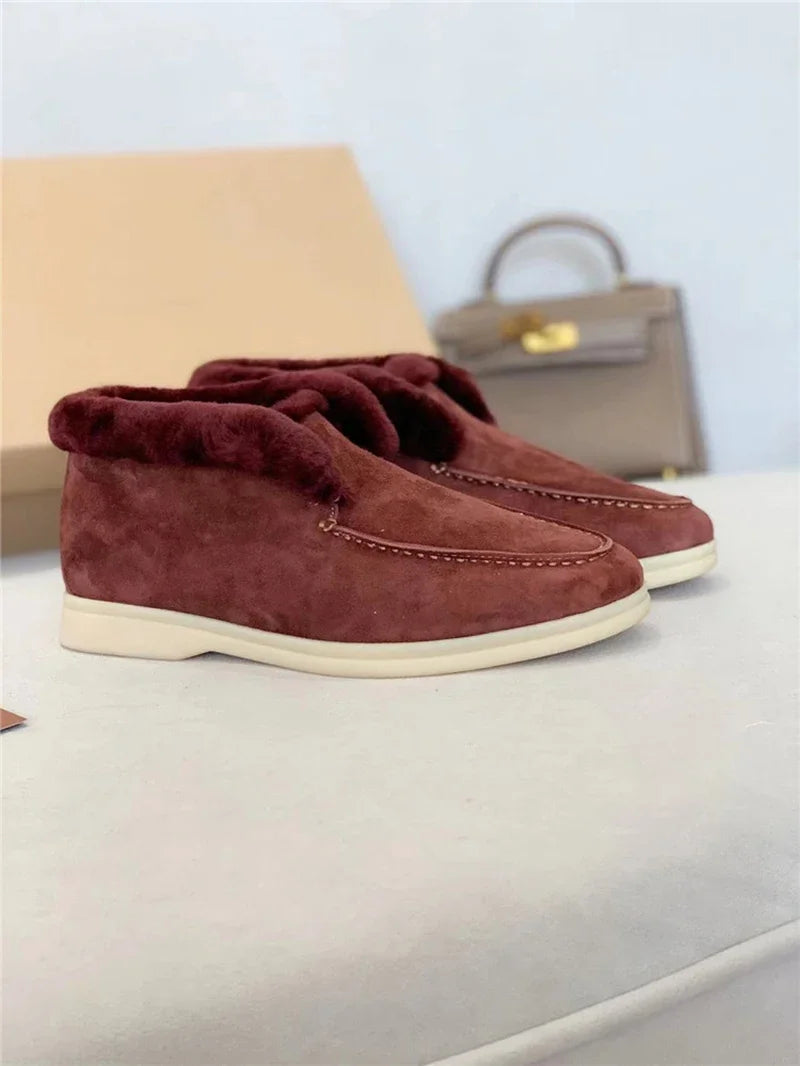 Wine red suede fur-lined loafers with side stitching and white rubber sole