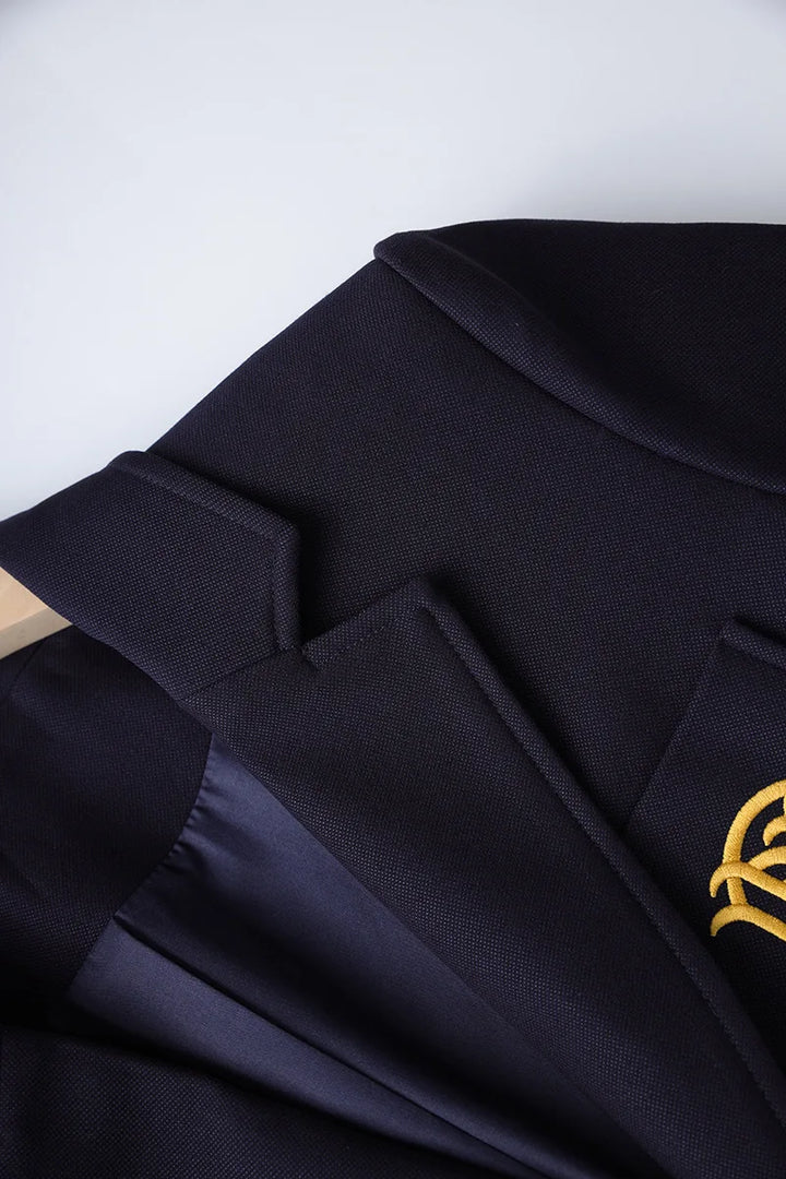 Navy blazer shoulder and lapel detail with crisp tailoring