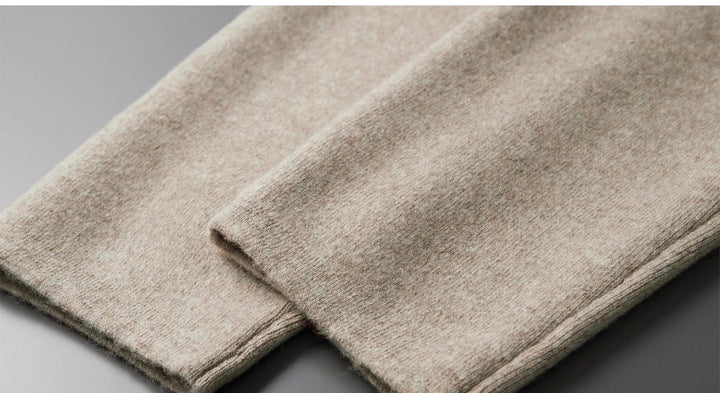 Beige wool knit pants hem and fold detail