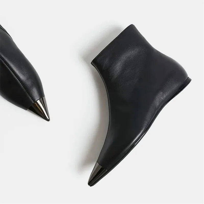 Black pointed-toe ankle heel boot, curved side view with smooth leather finish.