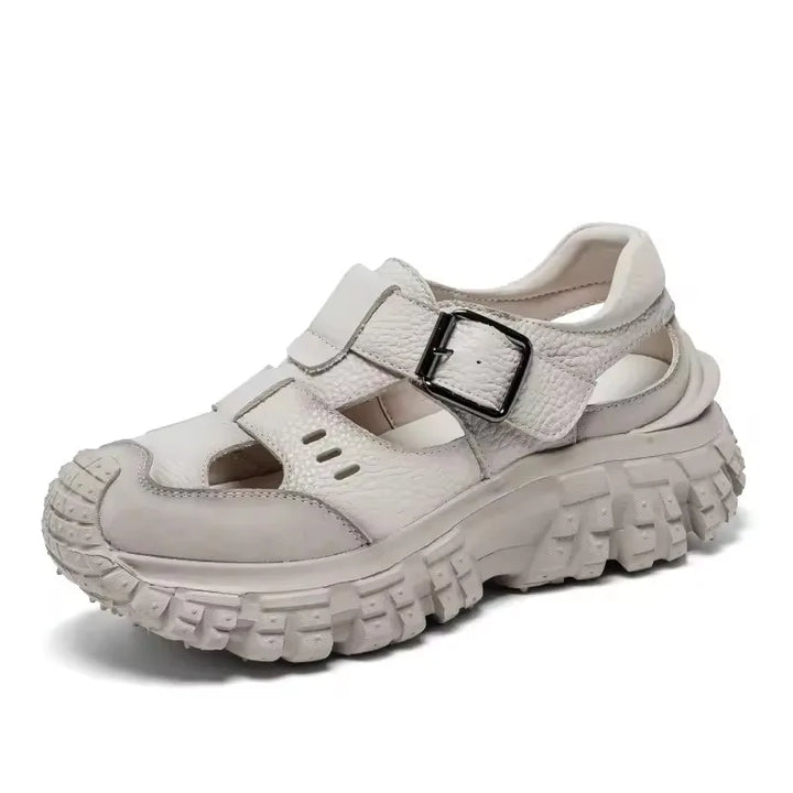 Women’s chunky sandals, light beige, front view with two buckled straps and thick sole