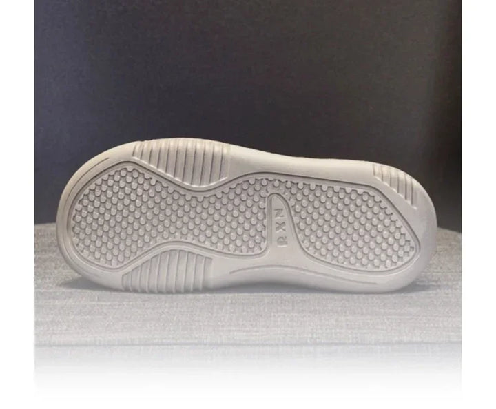 Thick-sole sandal outsole with textured grip tread, arched center support.