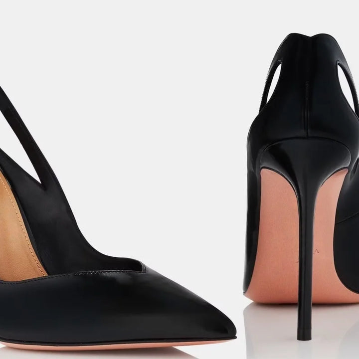 Black slip-on pointed-toe stiletto heels, close view of heel and toe