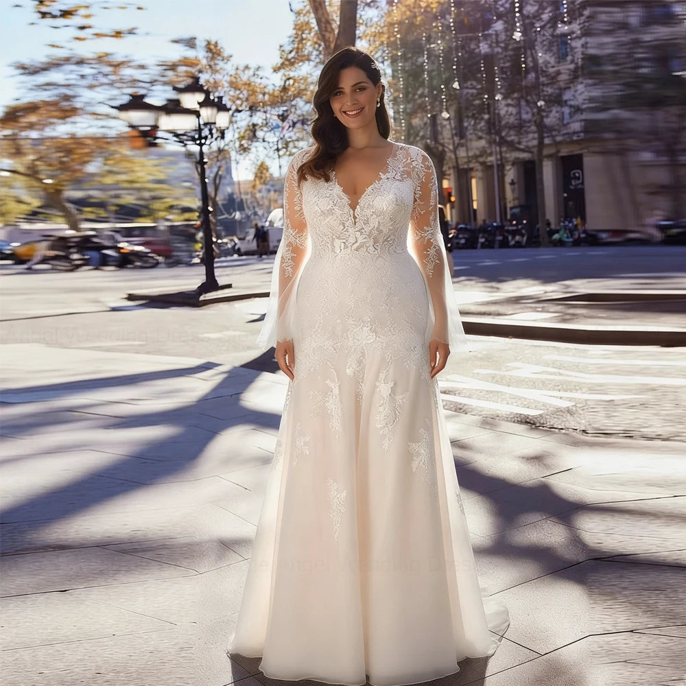 Ivory mermaid wedding dress with V-neck lace bodice and long flowing skirt