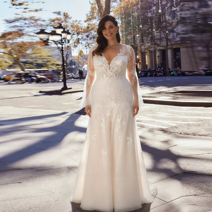 Ivory mermaid wedding dress with V-neck lace bodice and long flowing skirt