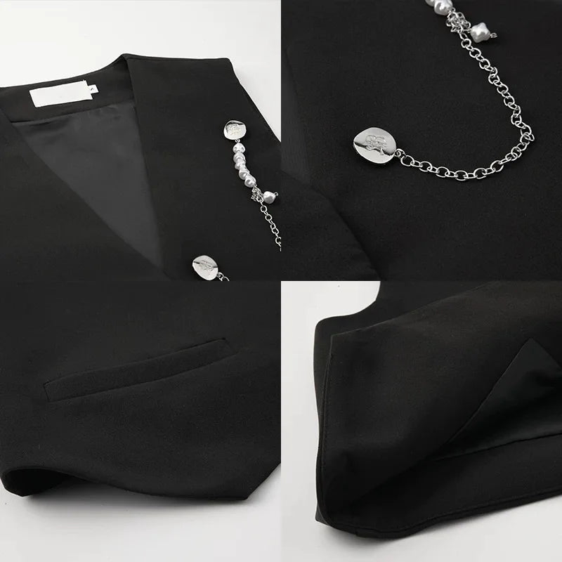 Black tailored waistcoat with lapels, pockets, and silver-tone coin and bead chain